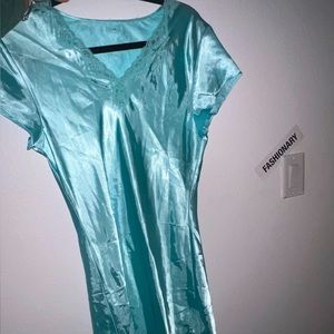 Coral teal colored slip dress with lace and mid length. Fitted size